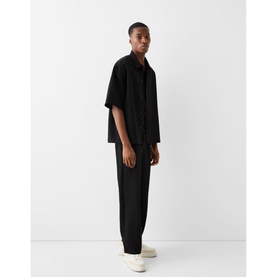 Bershka - Elegante broek met wijde pijpen in zwart Zwart