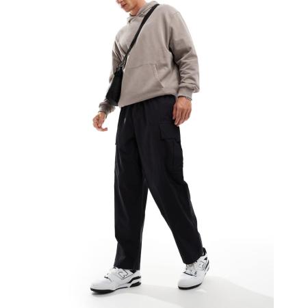 Another Influence - Parachute-cargobroek met wijde pijpen in zwart