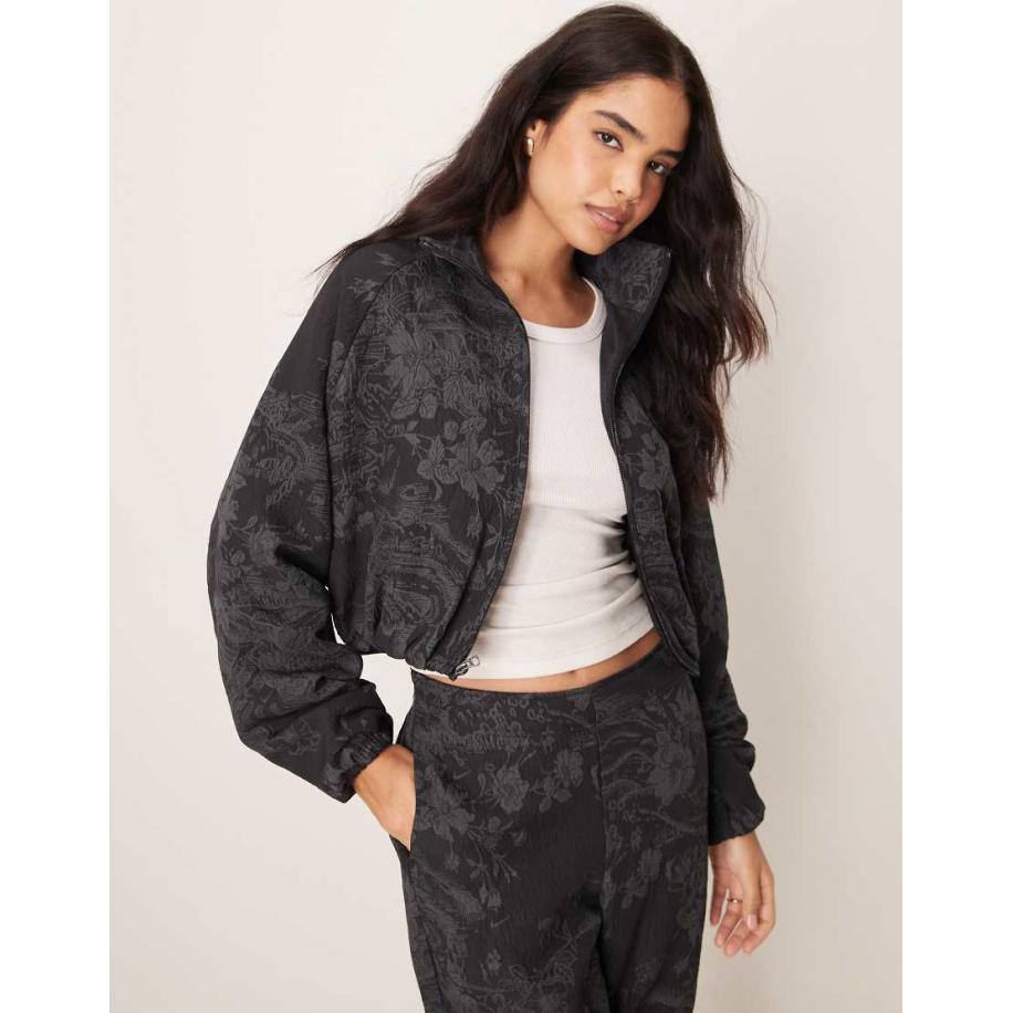 Nike MDC Jack van gebloemd jacquard in zwart en grijs Zwart