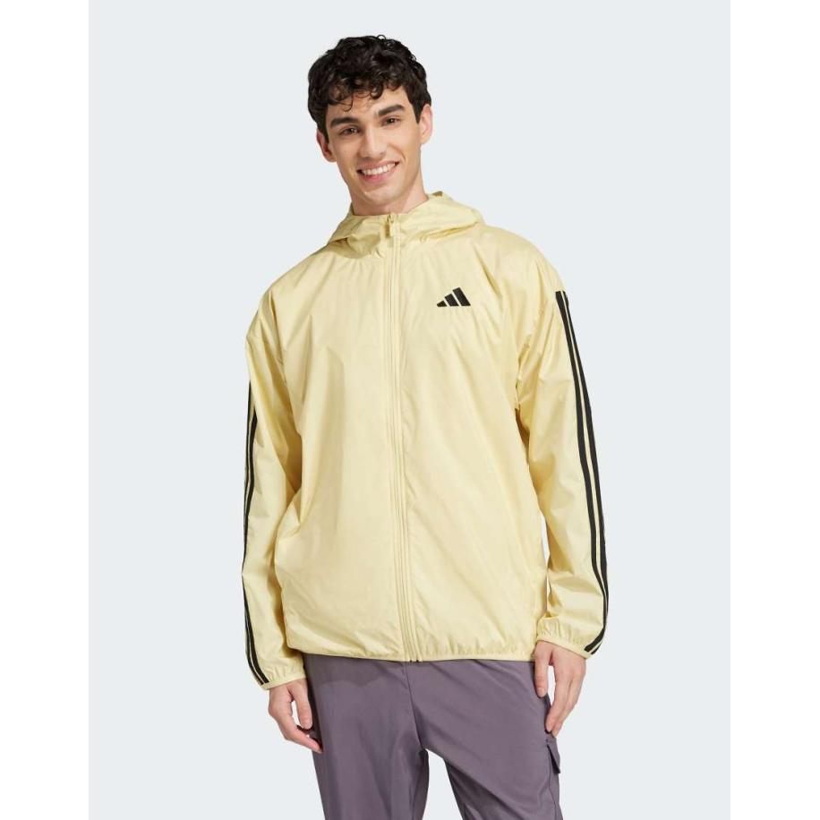 adidas - Essentials - Windjack met 3-stripes in geel en zwart Geel