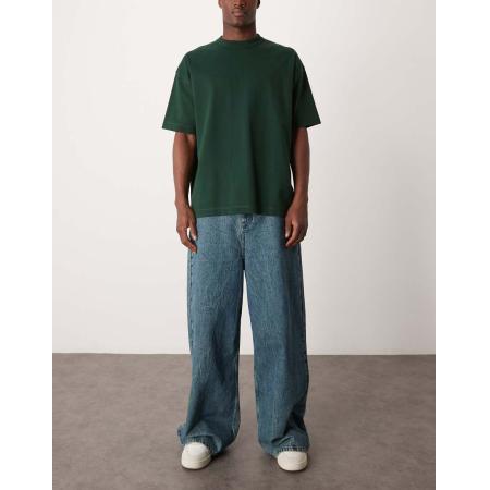 ASOS DESIGN - Jeans met lage taille, losse pasvorm en wijde zoom in zware gemarmerde blauwe wassing