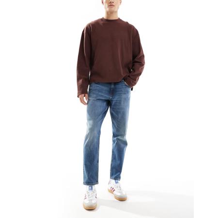 ASOS DESIGN - Stretchjeans met toelopende pasvorm in blauw met donkere wassing