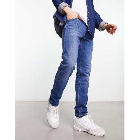 LEE - Luke - Smalle, toelopende jeans in vintage middenblauwe wassing
