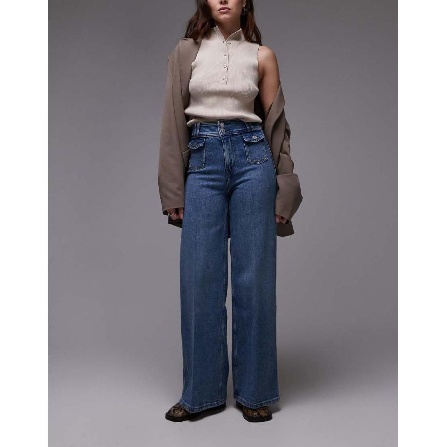 & Other Stories Jeans met wijde pijpen, hoge taille, tailleband met dubbele knoop en zakdetail in mid-wash blauw Blauw