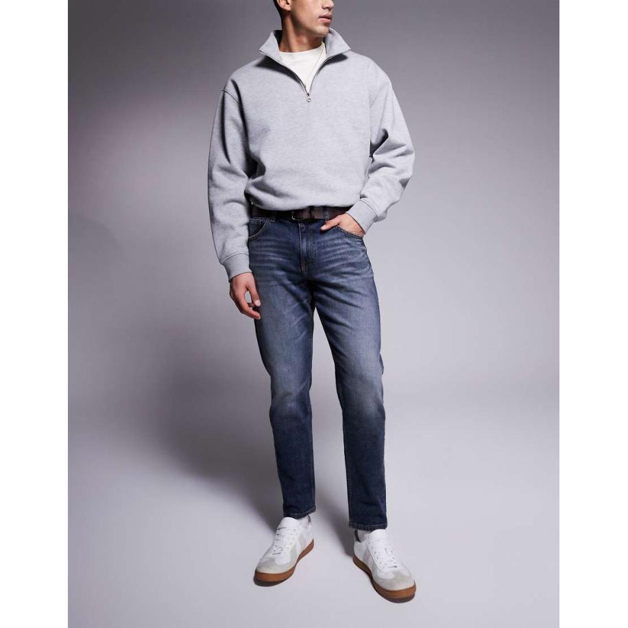 ASOS DESIGN - Smaltoelopende stretch jeans in blauwe midwash Blauw