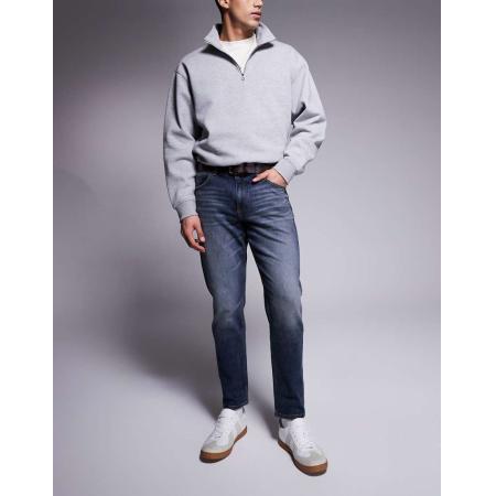 ASOS DESIGN - Smaltoelopende stretch jeans in blauwe midwash