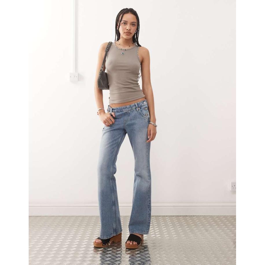 Weekday Flared jeans met lage taille en westerndetail met knopen aan de zijkant in streperige blauwe wassing Blauw