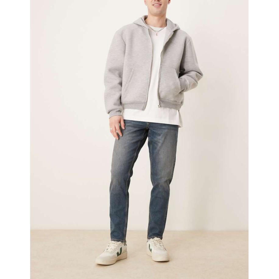 ASOS DESIGN - Smaltoelopende stretch jeans in blauwe midwash Blauw