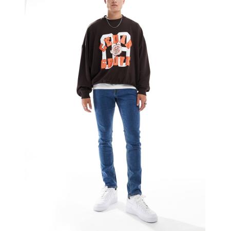 JJ Rebel - Luke - Slim-fit jeans in middenblauwe wassing