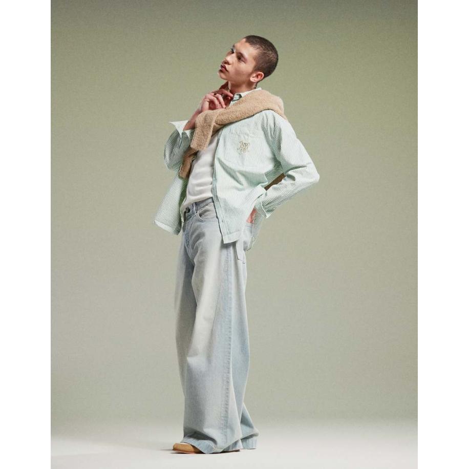 ASOS DESIGN - Jeans met superwijde pijpen en naaddetail in blauw met lichte wassing Blauw