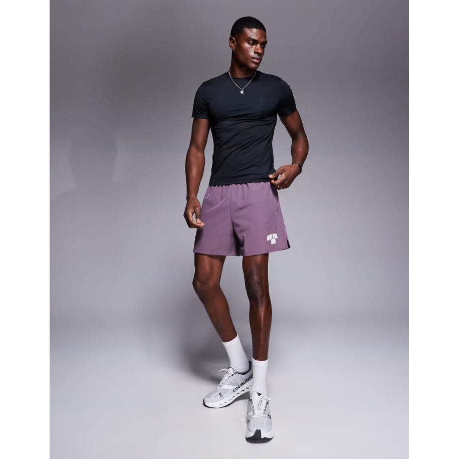 4505 - Tainingsshort van 18 cm met wijde pijpen, grafische print en ritszakken van sneldrogend badstof in paars Paars