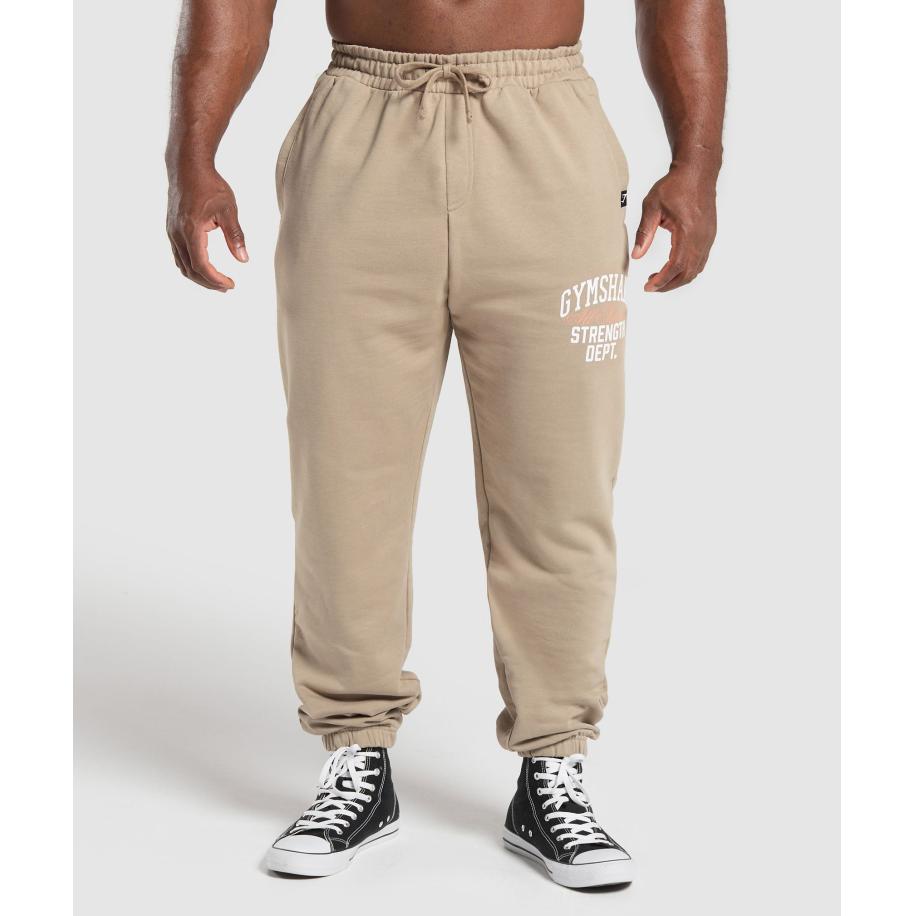 Gymshark Trophy Graphic Joggers Cement Brown Bruin