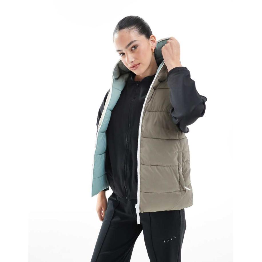 Born Living Yoga Hazel Omkeerbare sport bodywarmer in bruin en blauw-Veelkleurig Multicolor