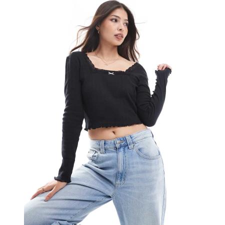 Wednesday's Girl Ajourgebreide top met rozet, vierkante hals en lange mouwen in zwart