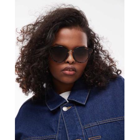 Le Specs Influx Ronde zonnebril met gouden detail in tortoise