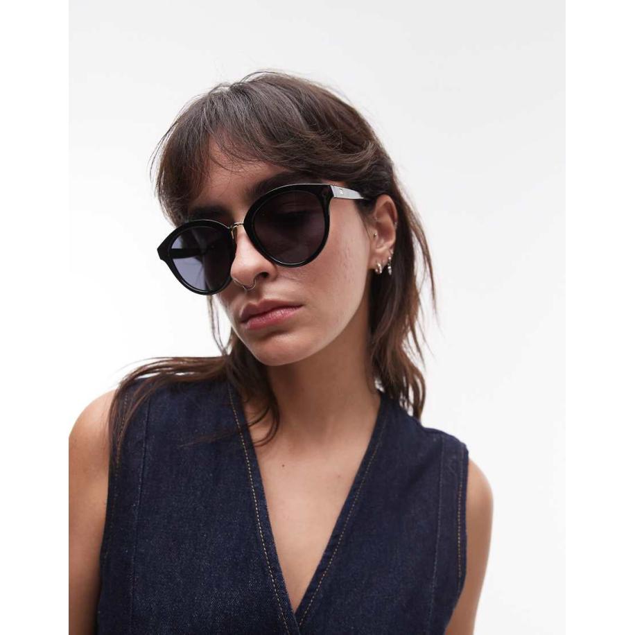 Le Specs Influx Ronde zonnebril met gouden detail in zwart Goud