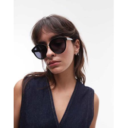 Le Specs Influx Ronde zonnebril met gouden detail in zwart